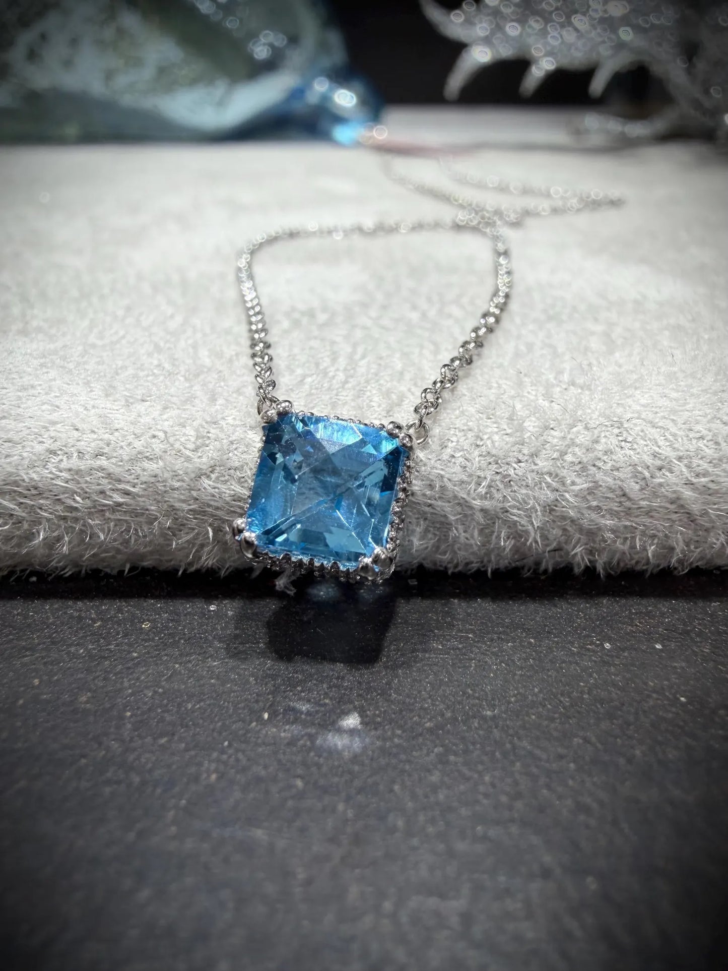 14K White Gold Blue Topaz and Diamond Necklace: 17” Square Checkerboard Cut Blue Topaz