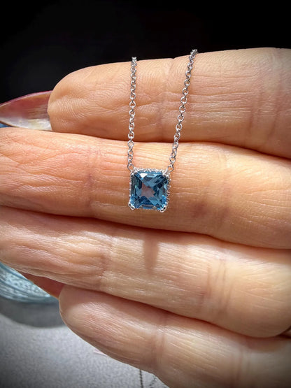 14K White Gold Blue Topaz and Diamond Necklace: 17” Square Checkerboard Cut Blue Topaz