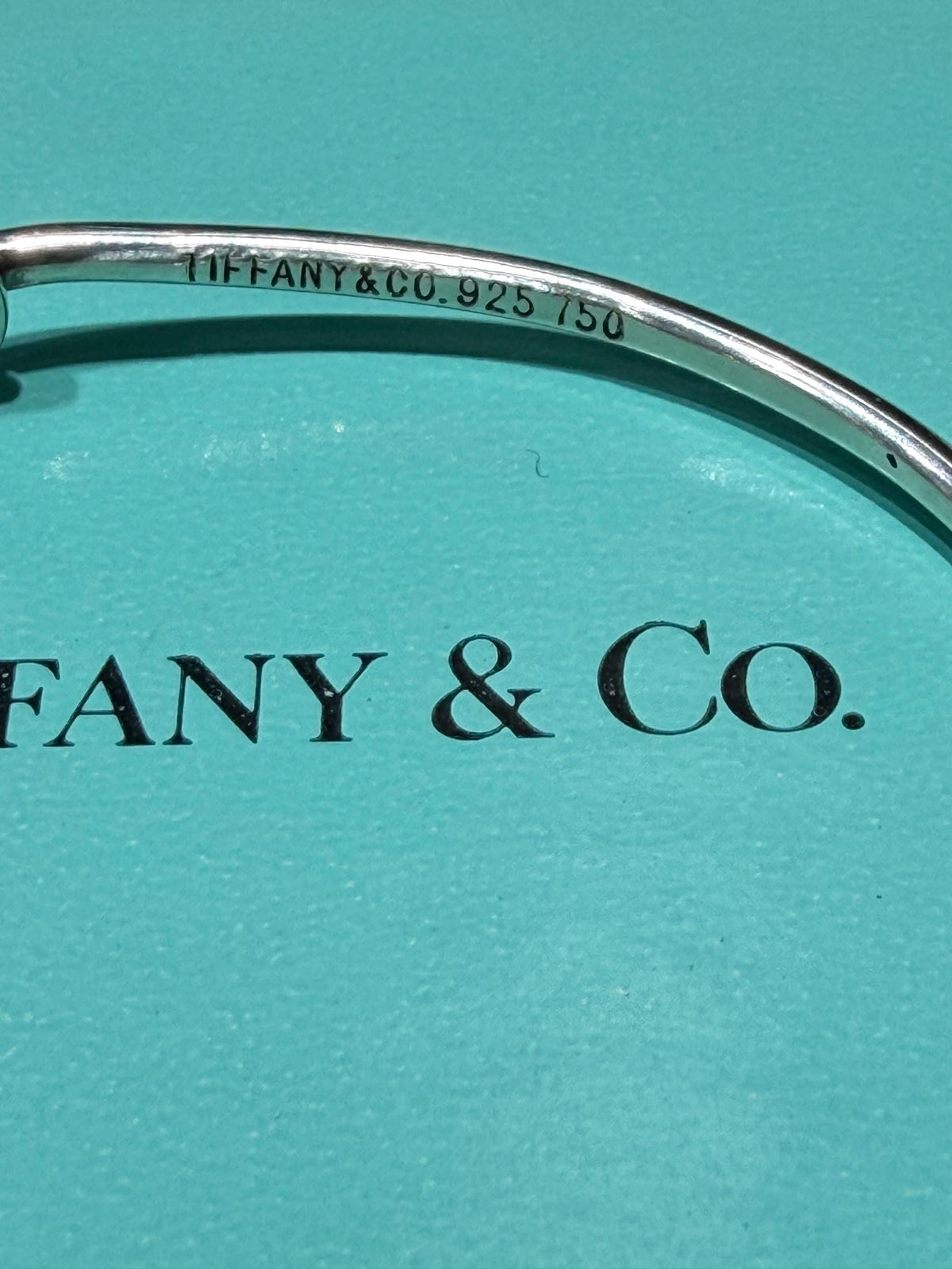 Tiffany & Co. 18K Gold Heart Love Knot Twist Sterling Silver Bangle Bracelet 925 750 with Box, Pouch, and Care Card.