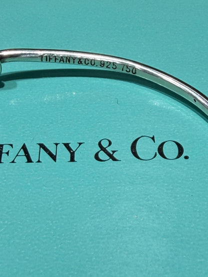 Tiffany & Co. 18K Gold Heart Love Knot Twist Sterling Silver Bangle Bracelet 925 750 with Box, Pouch, and Care Card.
