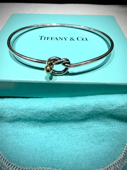 Tiffany & Co. 18K Gold Heart Love Knot Twist Sterling Silver Bangle Bracelet 925 750 with Box, Pouch, and Care Card.