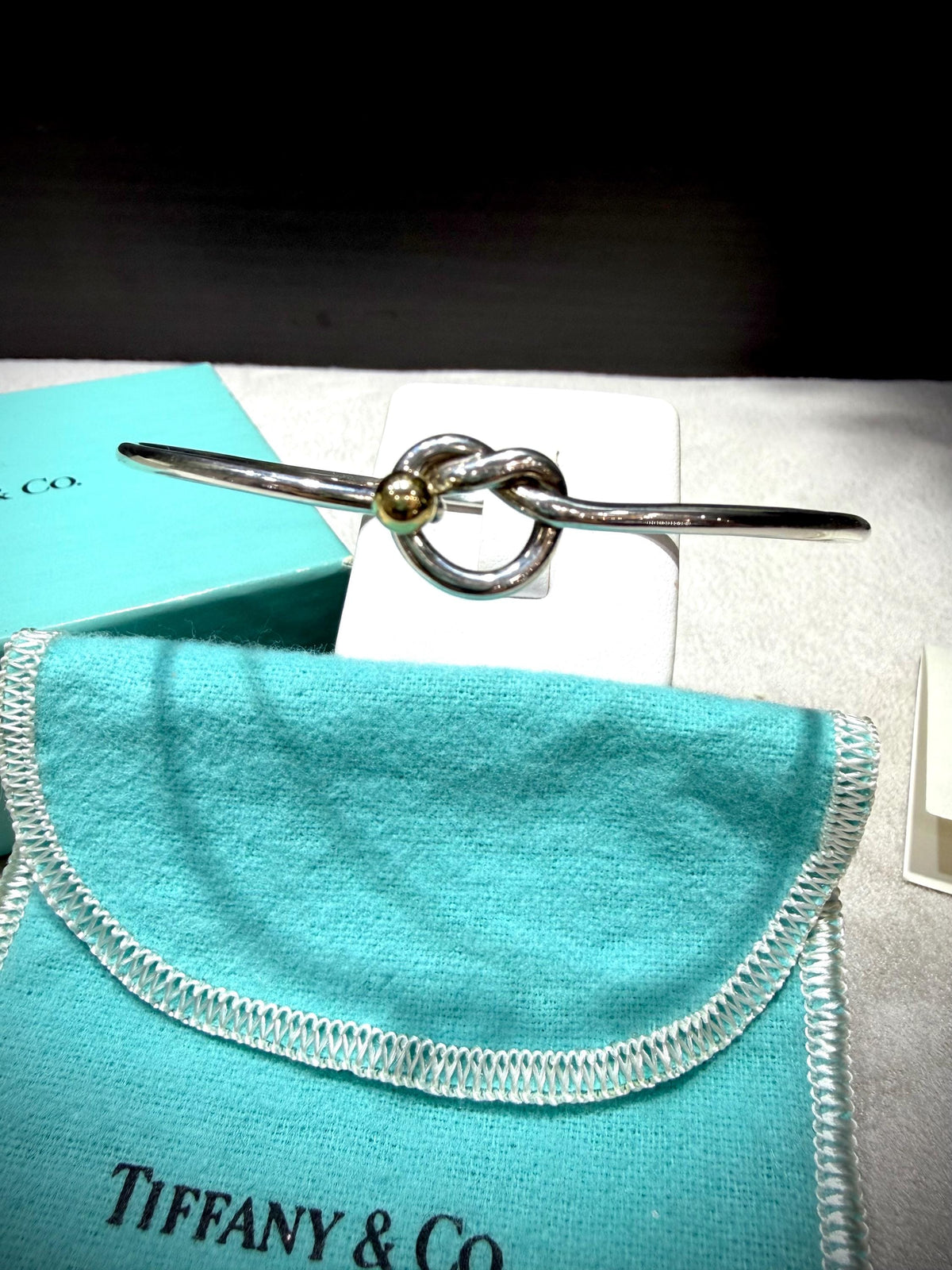 Tiffany & Co. 18K Gold Heart Love Knot Twist Sterling Silver Bangle Bracelet 925 750 with Box, Pouch, and Care Card.