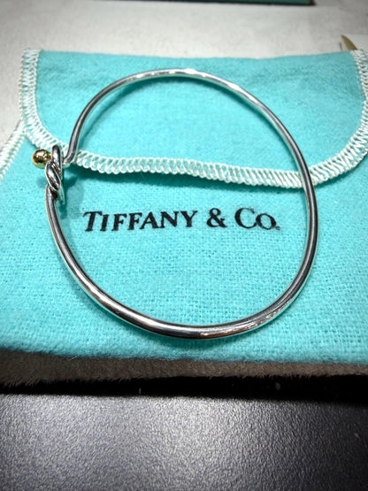 Tiffany & Co. 18K Gold Heart Love Knot Twist Sterling Silver Bangle Bracelet 925 750 with Box, Pouch, and Care Card.